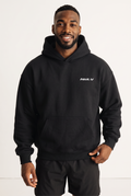 NWLY black oversized performance hoodie, front view
