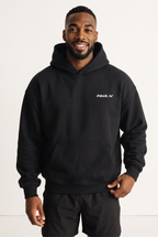 NWLY black oversized performance hoodie, front view