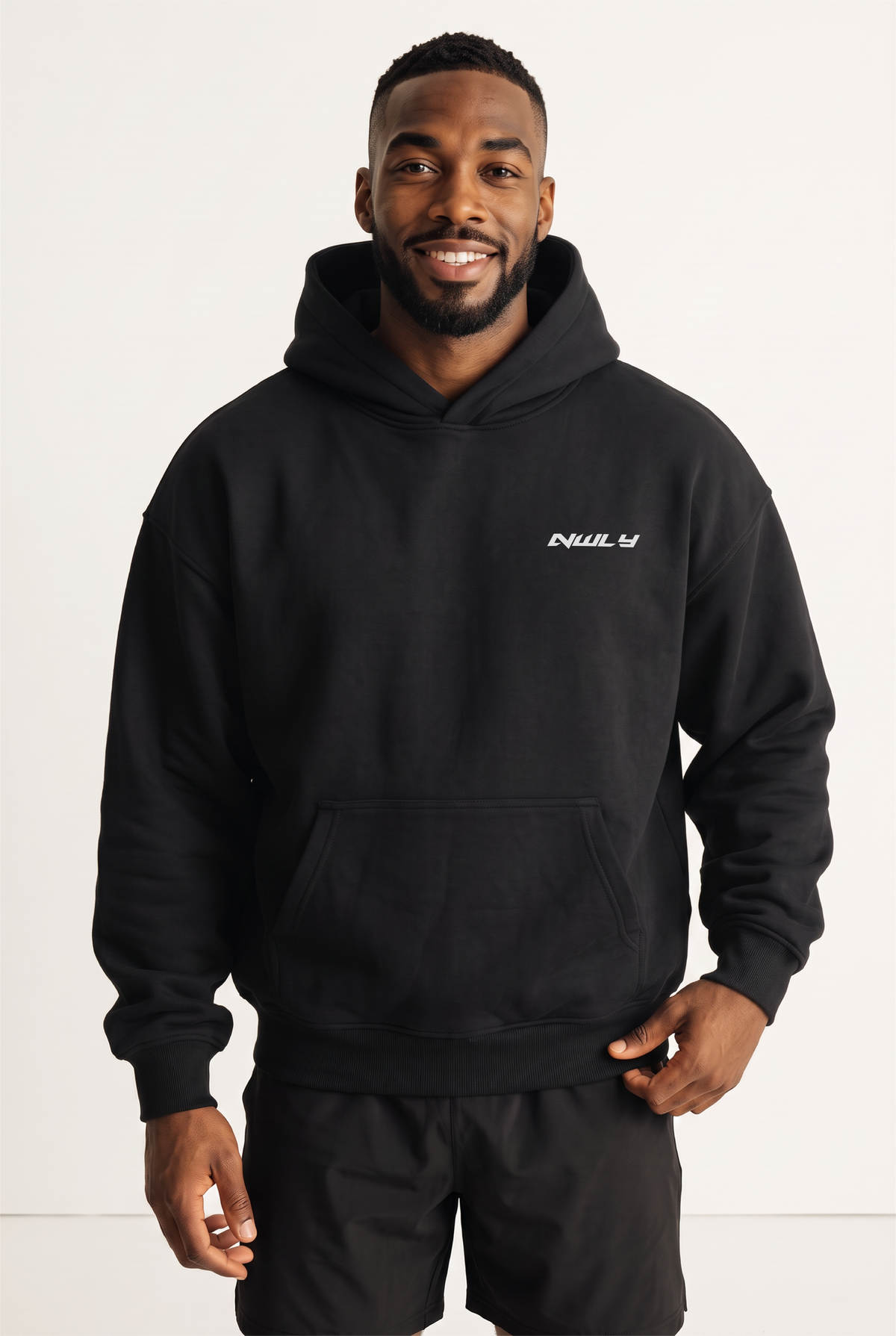 NWLY black oversized performance hoodie, front view