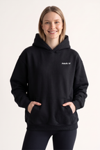 NWLY black oversized performance hoodie, women’s front view