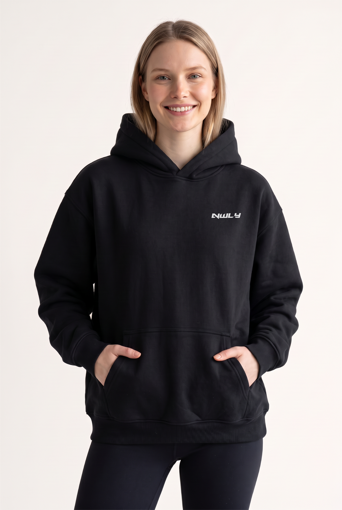 NWLY black oversized performance hoodie, women’s front view