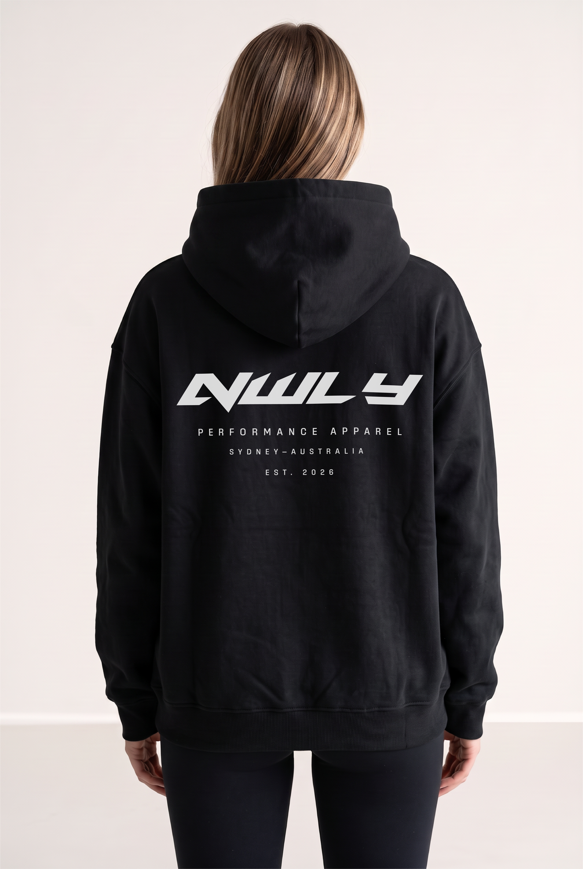 NWLY black oversized performance hoodie, rear graphic view