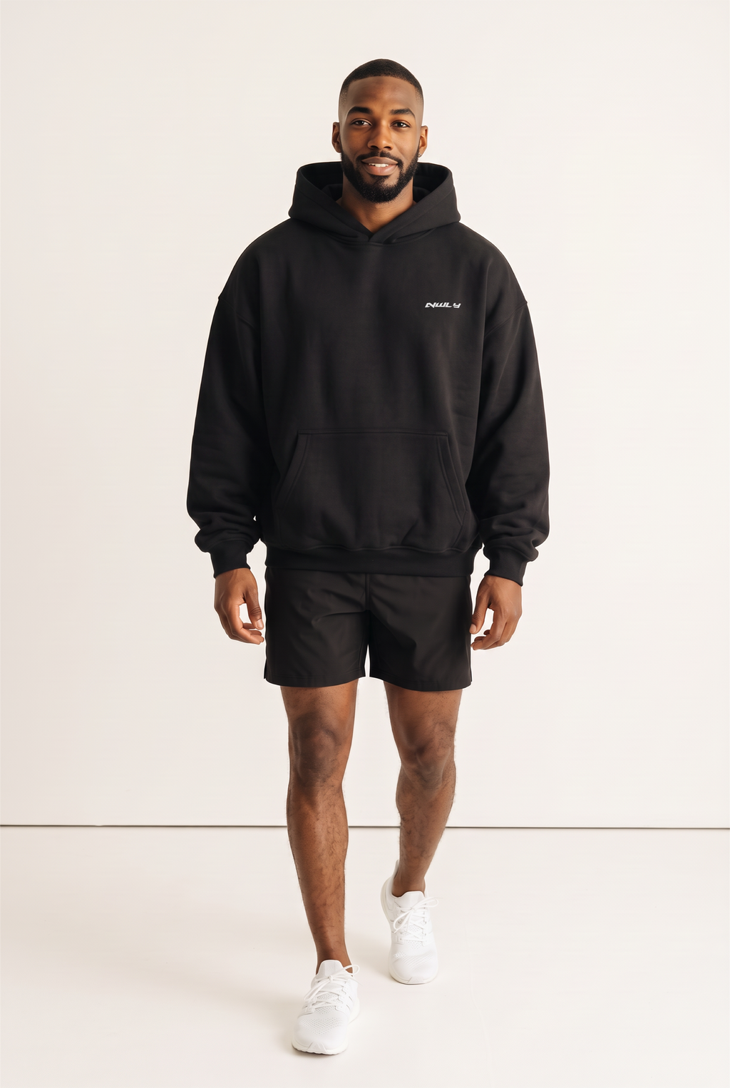 NWLY black oversized performance hoodie, full-length front view