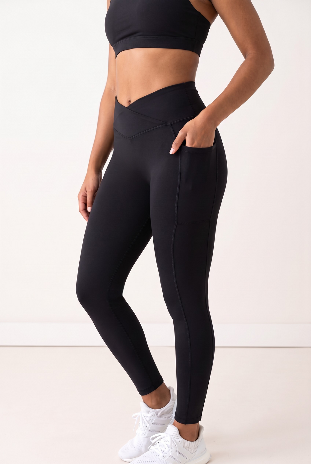 NWLY black performance leggings, crossover waistband and side pocket