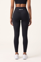 NWLY black performance leggings, full-length rear view