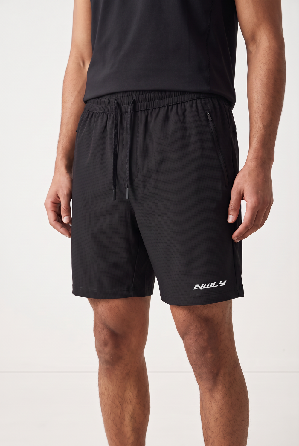 NWLY black performance training shorts, angled front view