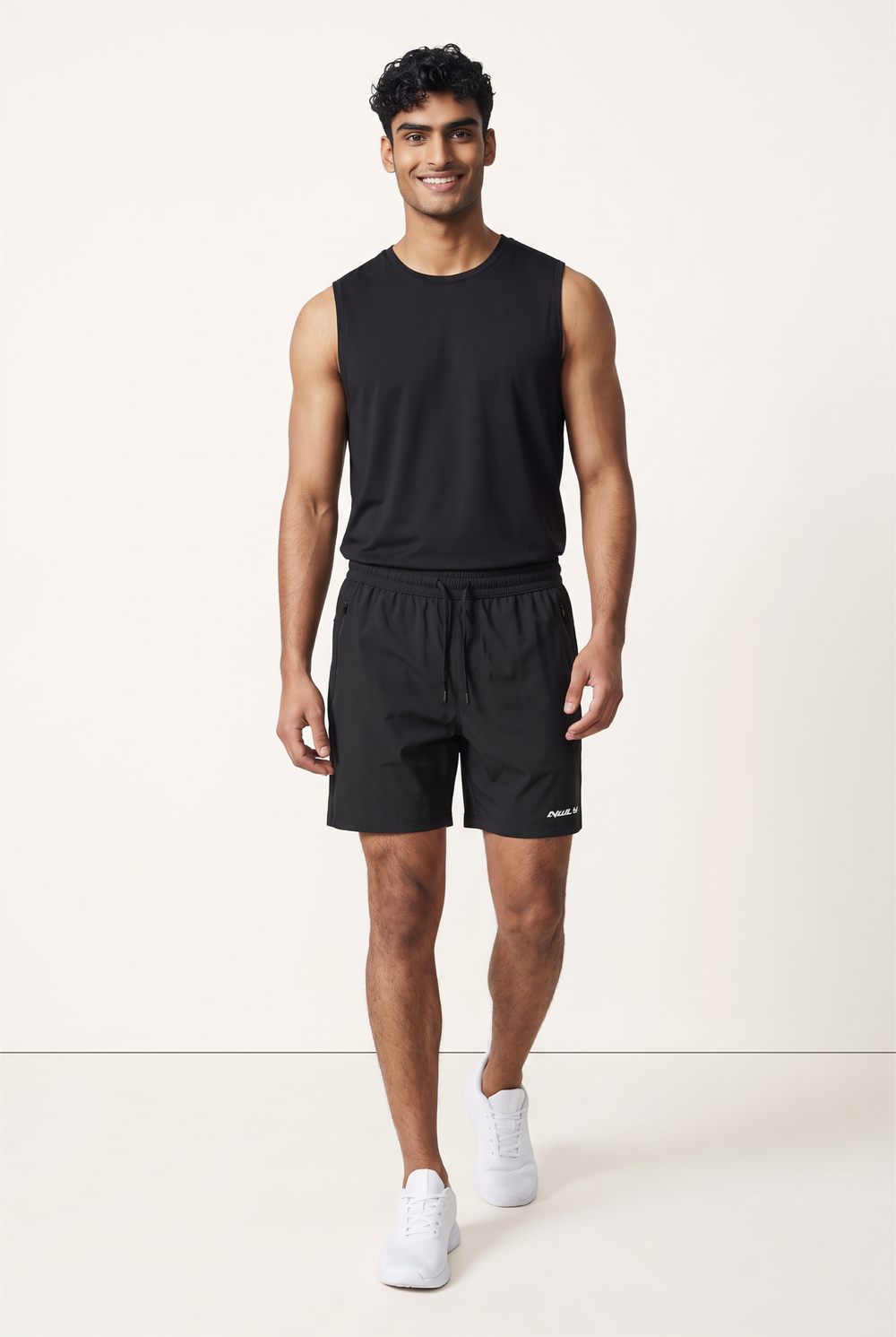 NWLY black performance training shorts, full-length model view